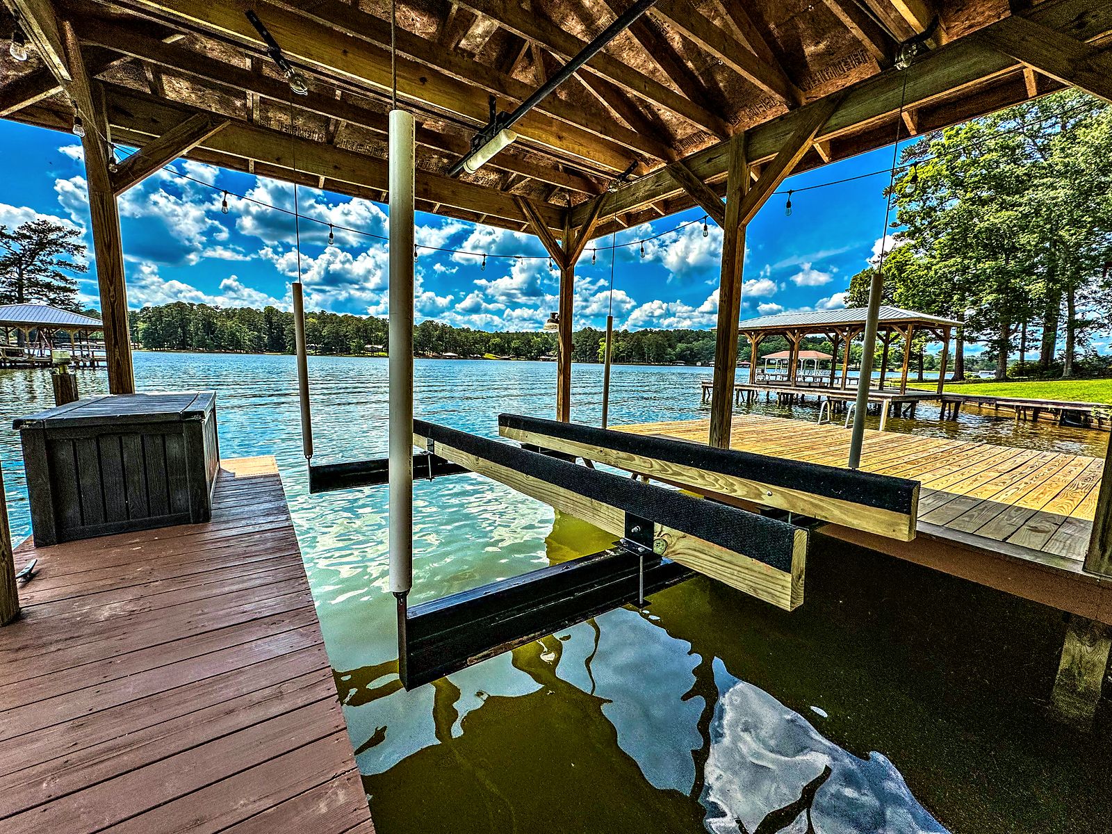 Covered boathouse and dock looking out over Lake Sinclair